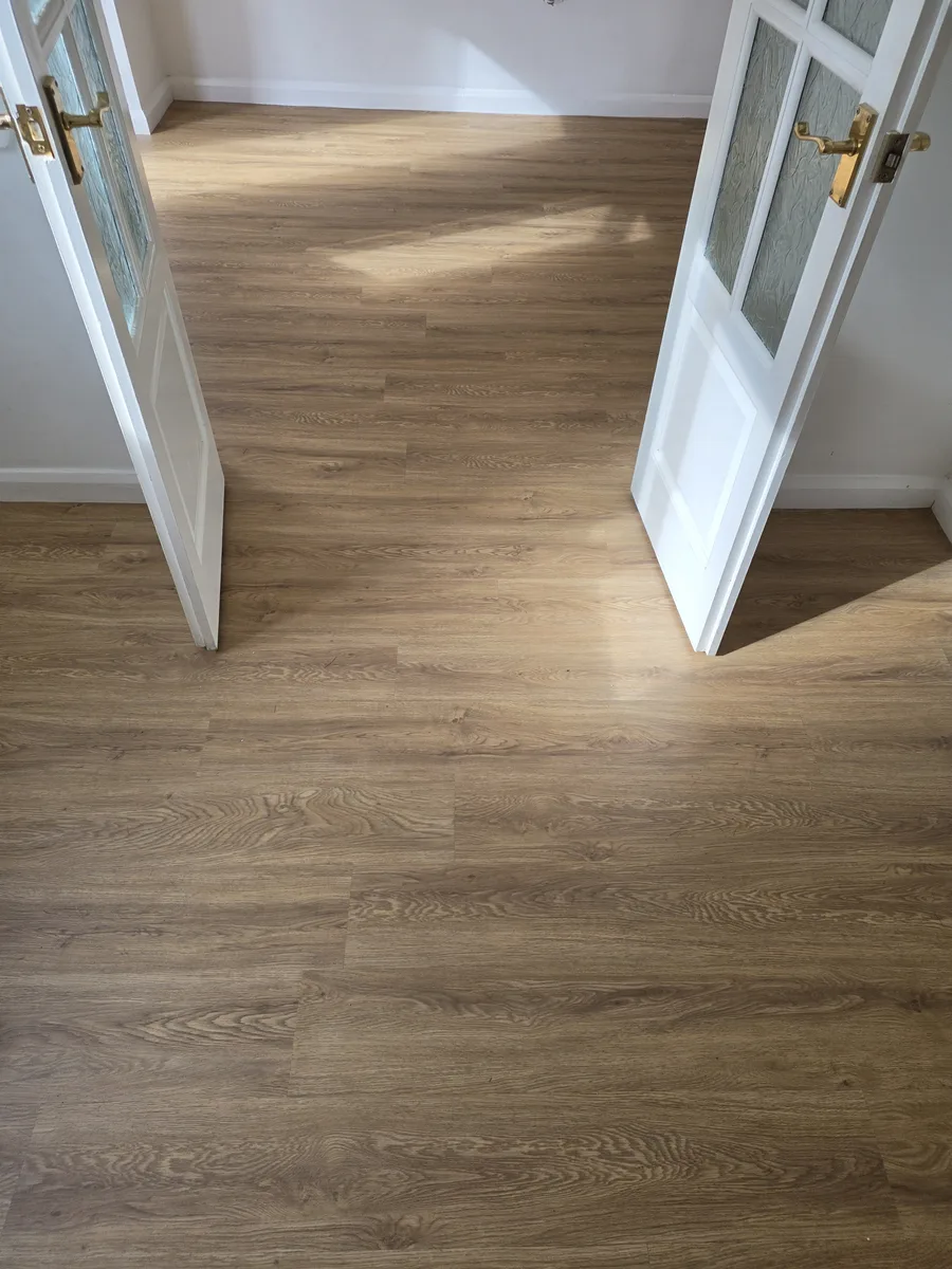 Camaro full-plank LVT fitted through adjoining rooms